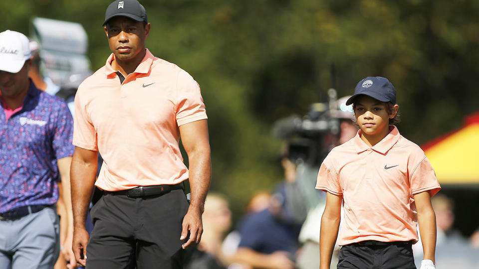 Tiger and Charlie Woods, pictured here walking down the first fairway at the PNC Championship. 