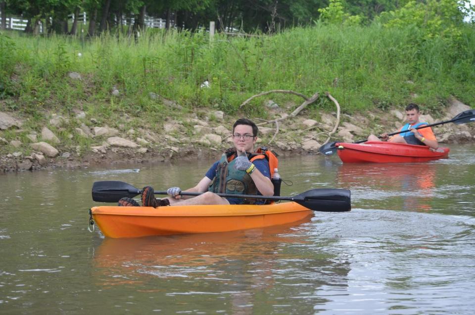 Andrew Phillips (front) and Henry Jordan paddle Beaver Creek during one of their many trips to accomplish their Eagle Scout projects.