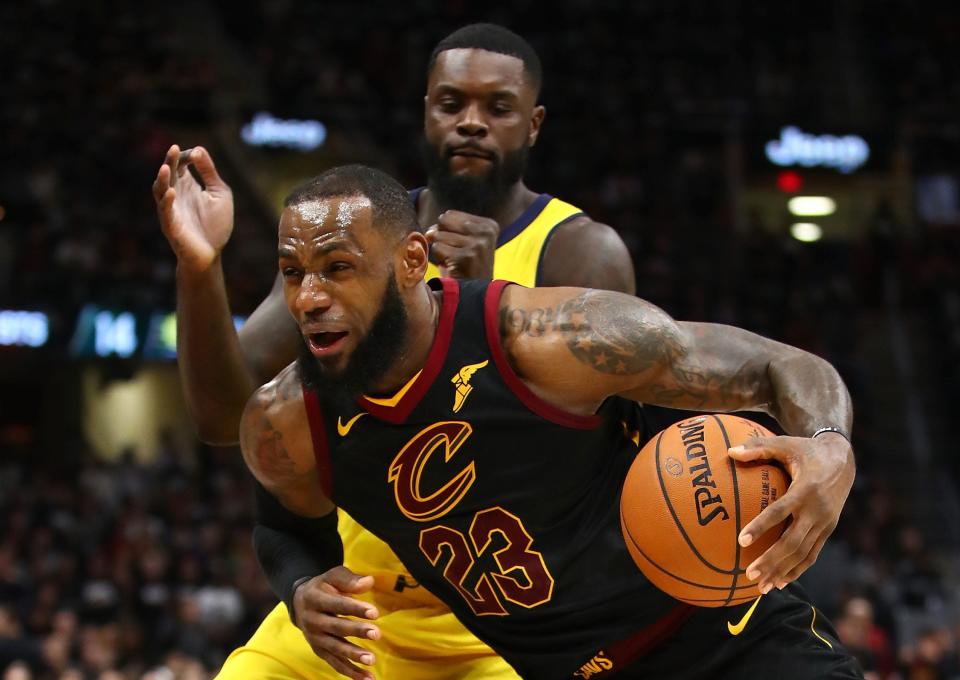 CLEVELAND, OH - APRIL 15:  LeBron James #23 of the Cleveland Cavaliers drives past Lance Stephenson #1 of the Indiana Pacers during the second half in Game One of the Eastern Conference Quarterfinals during the 2018 NBA Playoffs at Quicken Loans Arena on April 15, 2018 in Cleveland, Ohio. Indiana won the game 98-80 to take a 1-0 series lead. NOTE TO USER: User expressly acknowledges and agrees that, by downloading and or using this photograph, User is consenting to the terms and conditions of the Getty Images License Agreement. (Photo by Gregory Shamus/Getty Images)