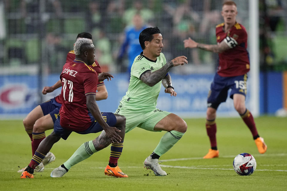 Austin FC forward Sebastian Driussi, center, moves the ball past Real Salt Lake forward Carlos Andrés Gomez (11) during the second half of an MLS soccer match in Austin, Texas, Saturday, June 3, 2023. (AP Photo/Eric Gay)