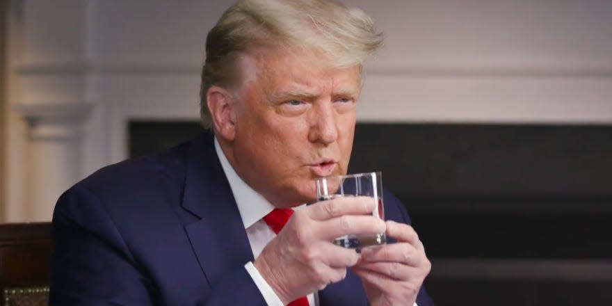 Trump drinking water on 60 minutes orange tan white hands