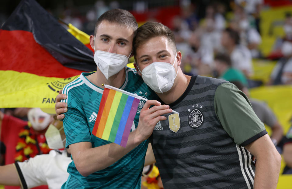 MUNICH, GERMANY - JUNE 23: Fans of Germany hold a rainbow flag prior to the UEFA Euro 2020 Championship Group F match between Germany and Hungary at Allianz Arena on June 23, 2021 in Munich, Germany. (Photo by Alex Grimm - UEFA/UEFA via Getty Images)