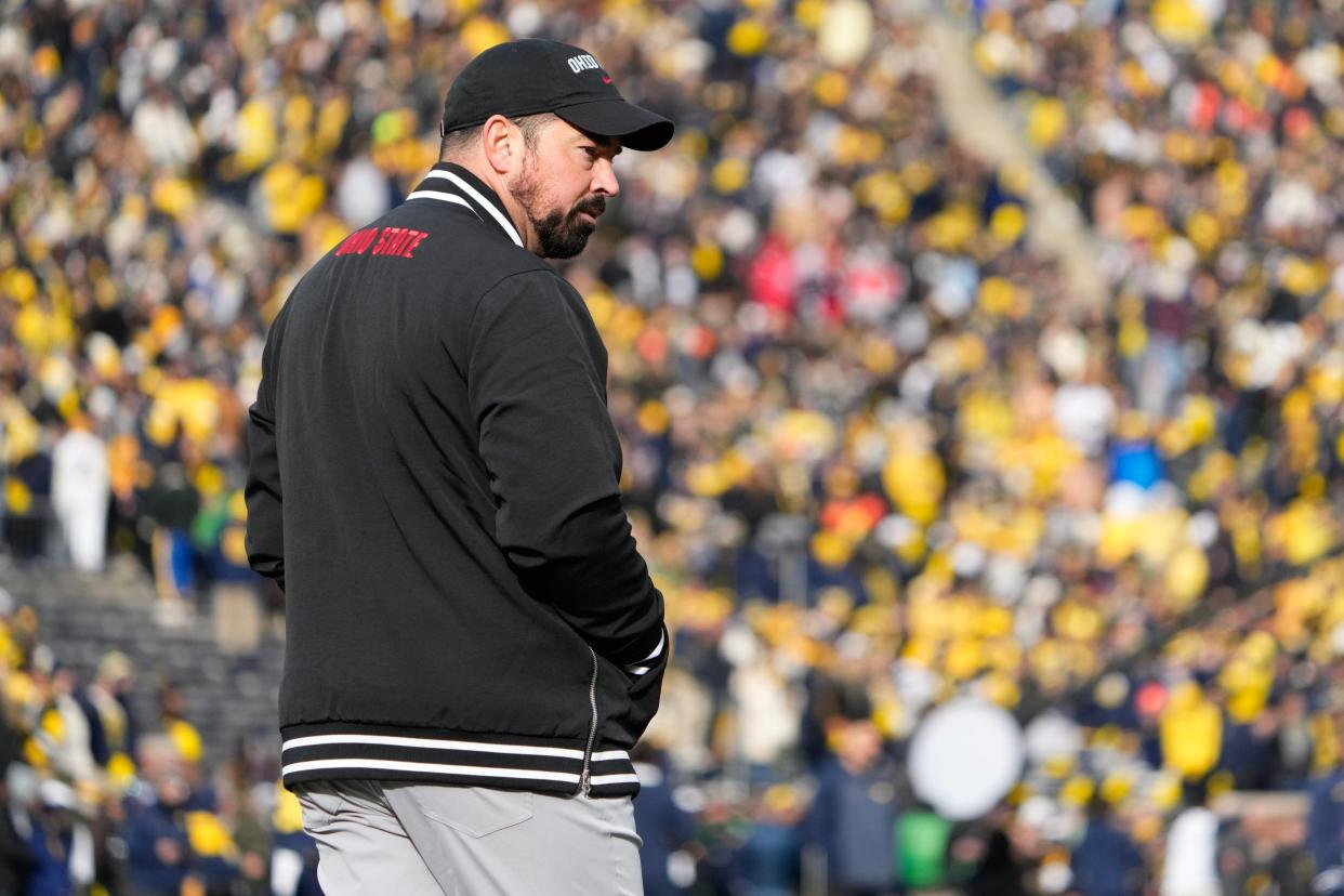 Ohio State coach Ryan Day leads his team in warmups prior to the Buckeyes' 30-24 loss to Michigan.