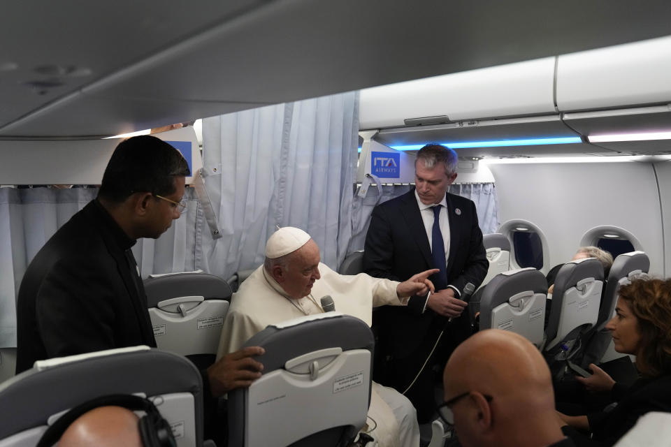 Pope Francis addresses journalists on board an airplane on his flight back from Marseille to Rome, Saturday, Sept. 23, 2023. Francis just ended a two-day visit to Marseille where he joined Catholic bishops from the Mediterranean region on discussions largely focused on migration. (AP Photo/Alessandra Tarantino, Pool)