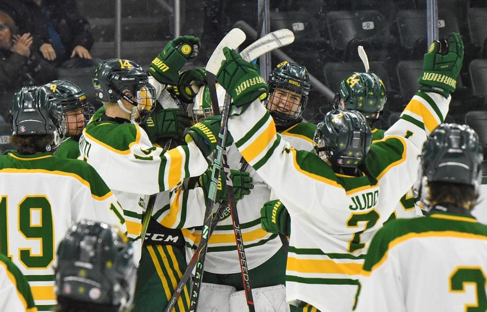 Howell players celebrate their program's first regional hockey championship since 2020 following a 3-1 victory over the Eastside Stars Wednesday, Feb. 28, 2024 at Munn Ice Arena.
