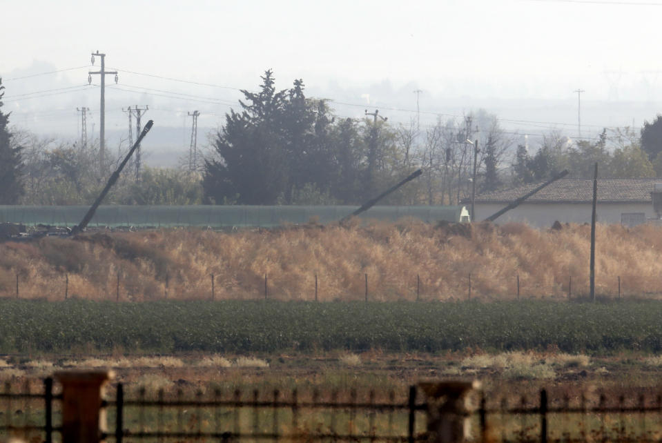 Turkish forces artillery pieces in Akcakale, Sanliurfa province, southeastern Turkey, fire targets towards Syria, Friday, Oct. 11, 2019.(AP Photo/Lefteris Pitarakis)