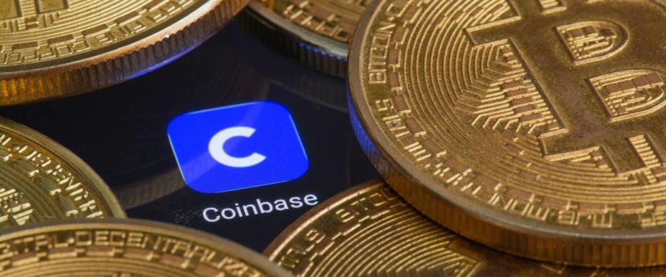 Coinbase logo covered in bitcoins