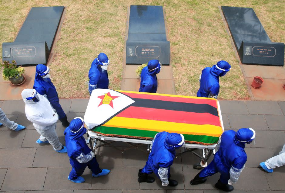 Pallbearers carry a coffin at the burial of two cabinet ministers and a retired general who died after contracting Covid-19 in Harare, Jan. 27. 