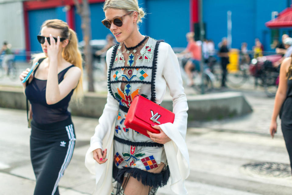 She’s totally showing off that coveted Louis Vuitton logo to the street-style photographers — not that we wouldn’t do the same thing, at New York Fashion Week.