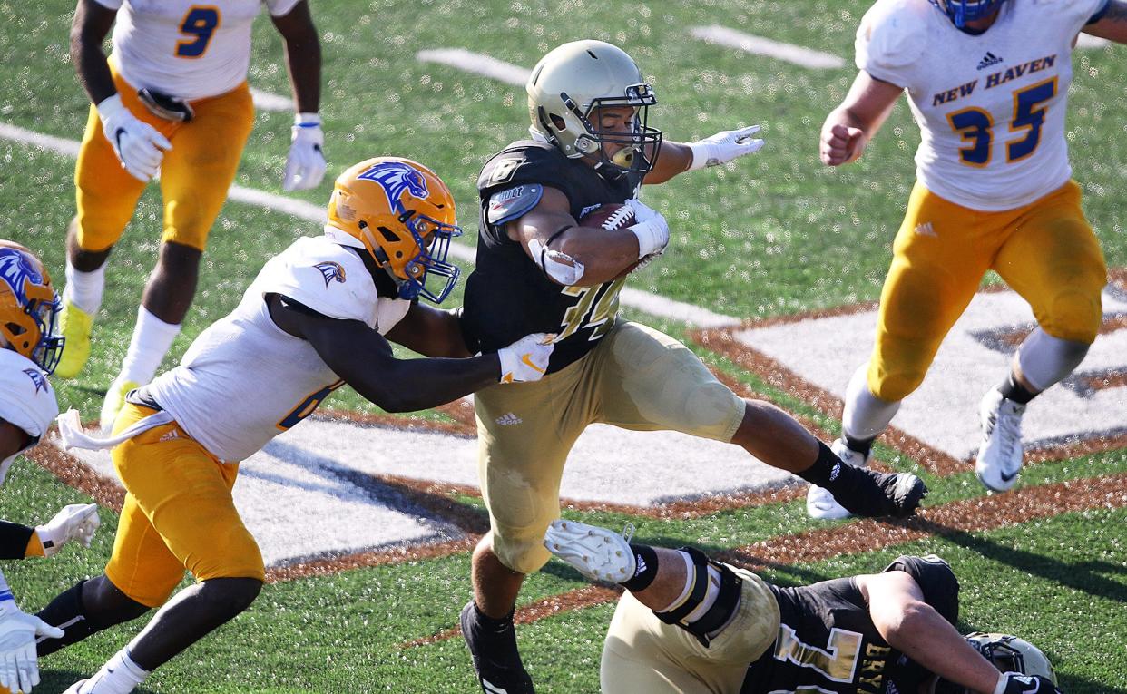 Bryant's Daniel Adeboboye runs after a catch during a game against New Haven in 2018. Next season, the Bulldogs will be playing teams from the Big South Conference.