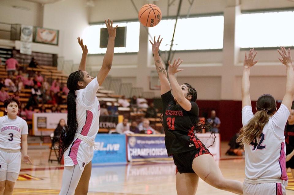 Westchester's Serenity Johnson shoots over Birmingham defender Zoee Mitchell.