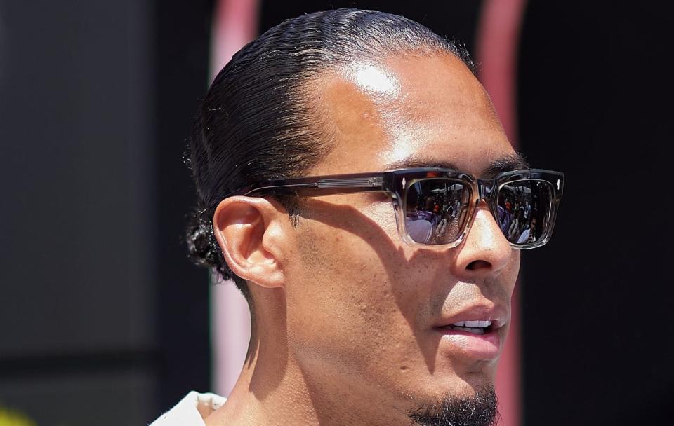 Virgil van Dijk looks on in the Monaco paddock