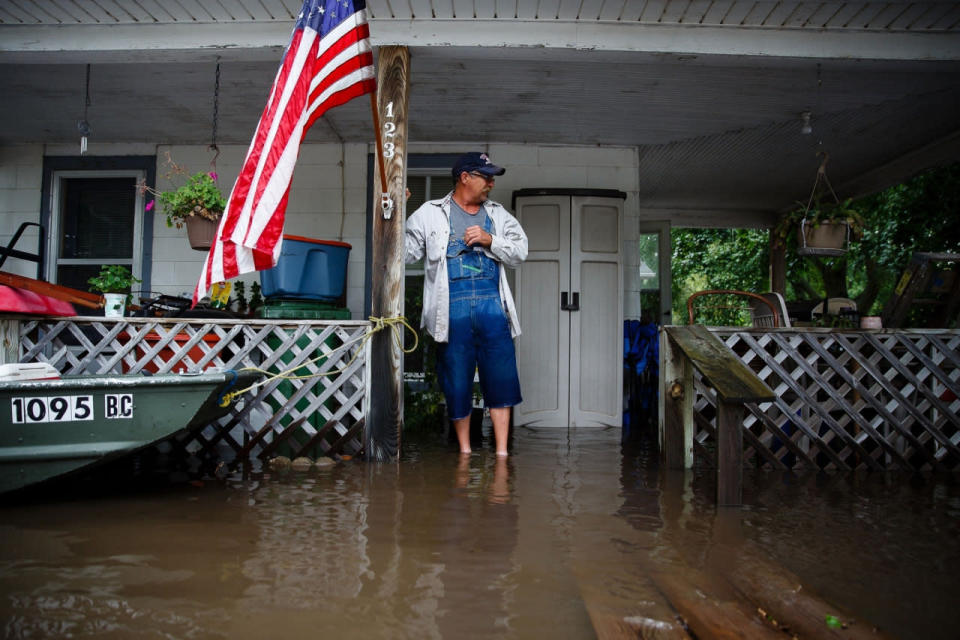 <p>Tom Moffitt stands on his deck as he looks at the flood waters on Friday, Sept. 23, 2016, in Shell Rock, Iowa. (Brian Powers/The Des Moines Register via AP )</p>