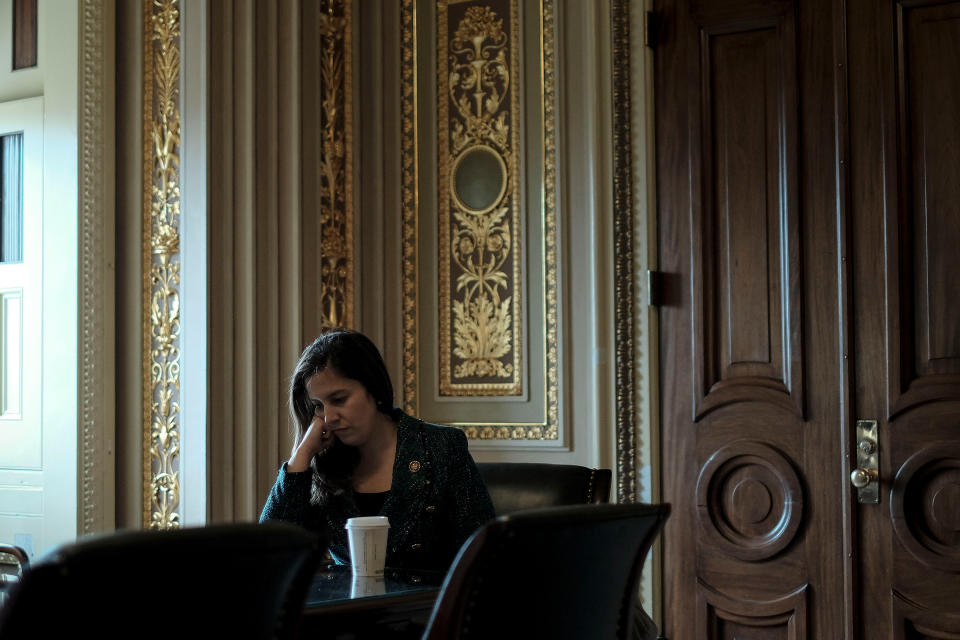 Rep. Elise Stefanik (R-N.Y.), an advisor to Trump's defense team, sits with her staffers outside the defense team meeting room before the impeachment trial at the Capitol in Washington, D.C., on Jan. 24, 2020. | Gabriella Demczuk for TIME
