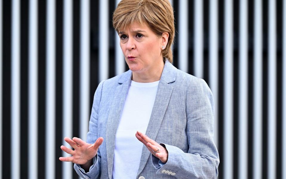 JUNE 21: Scotland's First Minister Nicola Sturgeon talks with the media after receiving her second dose of the Oxford/AstraZeneca Covid-19 vaccine at the NHS Louisa Jordan vaccine centre on June 21, 2021 in Glasgow, Scotland. More than 2.5 million people in Scotland have received their second Covid-19 vaccine dose.  - Getty Images