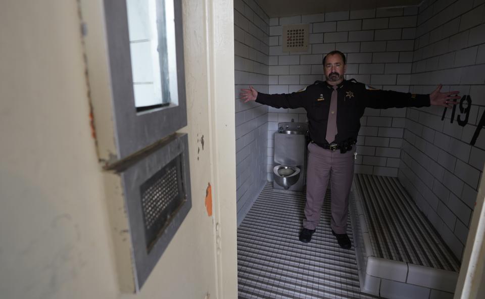 Dane County, Wis., Sheriff David Mahoney stands in a solitary confinement cell at the county jail. An advocate for the mentally ill, Mahoney says he sometimes has to lock certain inmates in these cells even though he calls the conditions "inhumane." Mahoney hopes to secure funding to replace the jail with one that will have a hospital-like wing. (AP Photo/Morry Gash)