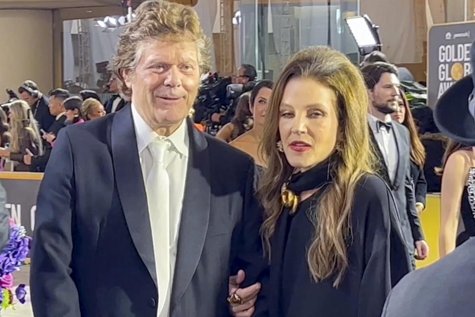 Lisa Marie Presley arriving at the Golden Globes along with her manager, Jerry Schilling