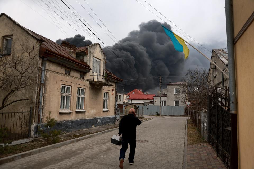Smoke from a fire at an industrial facility in Lviv rises over the city (Getty)
