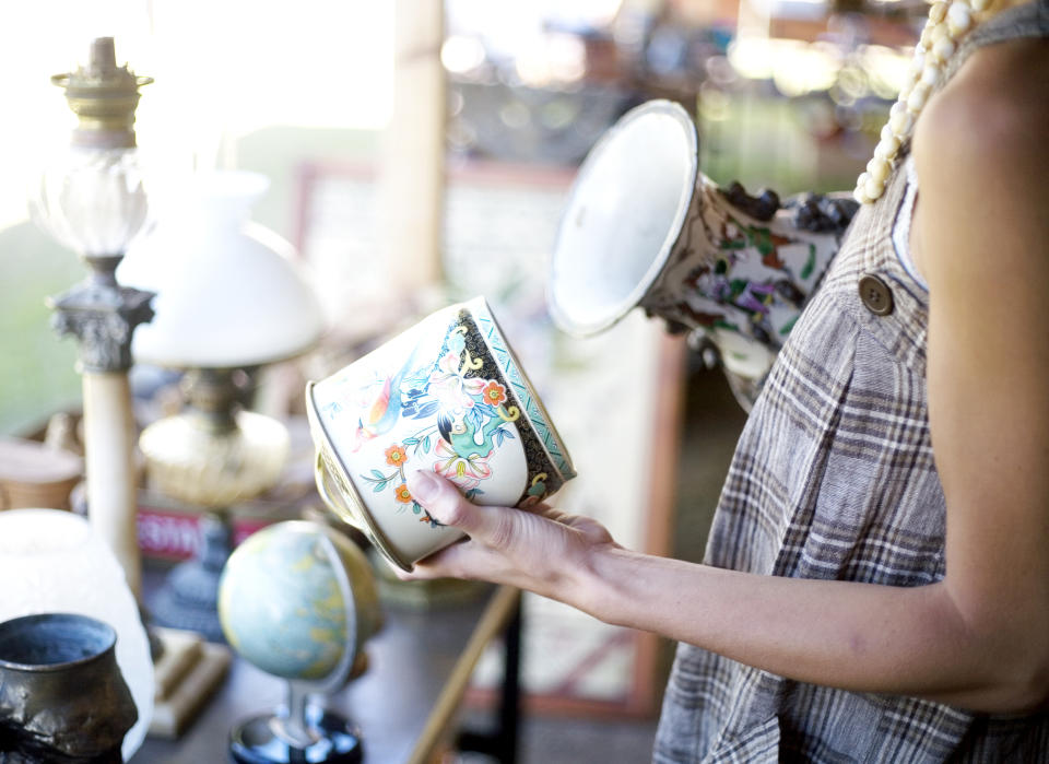 a person shopping in an antique store