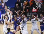 New York Knicks guard RJ Barrett (9) shoots in front of Utah Jazz center Rudy Gobert (27) during the first half of an NBA basketball game Wednesday, Jan. 6, 2021, in New York. (Wendell Cruz/Pool Photo via AP)