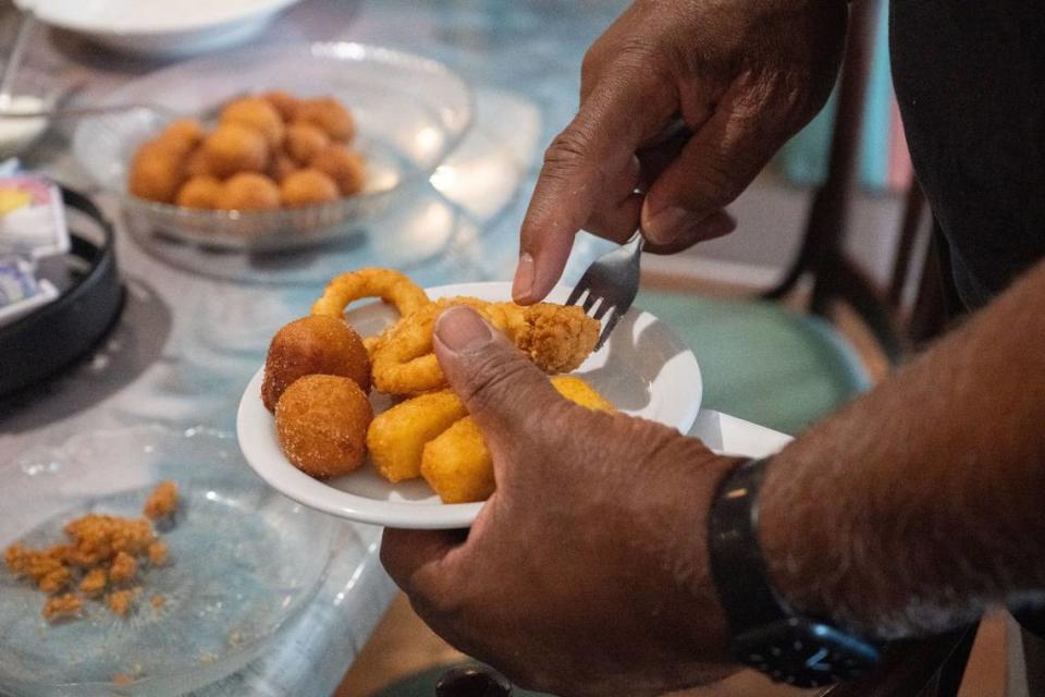 Larry Craig-Arriba, 2024 Community Ambassador with the Neighborhood Development Action Team, puts together a sampling of fried foods at Sammy’s Restaurant in North Sacramento on Friday, July 19, 2024. Craig-Arriba said he hopes the restaurant’s grand reopening “helps to revitalize the whole boulevard.”