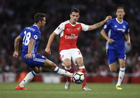 Britain Football Soccer - Arsenal v Chelsea - Premier League - Emirates Stadium - 24/9/16 Chelsea's Cesar Azpilicueta in action with Arsenal's Granit Xhaka Reuters / Dylan Martinez Livepic