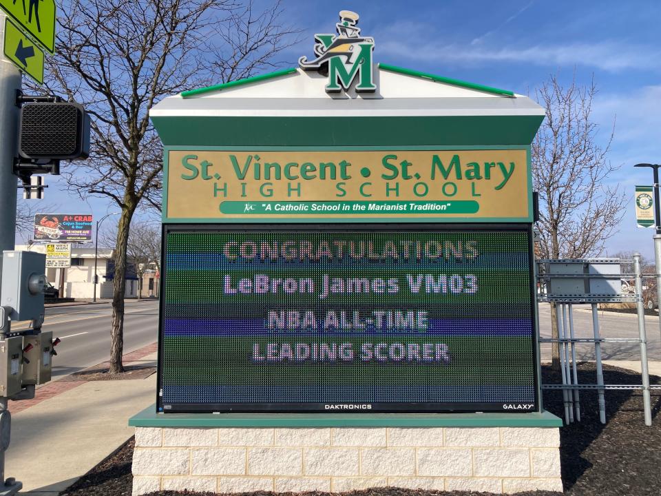 St. Vincent-St. Mary’s sign on West Market Street congratulates LeBron James on breaking the NBA scoring record.
