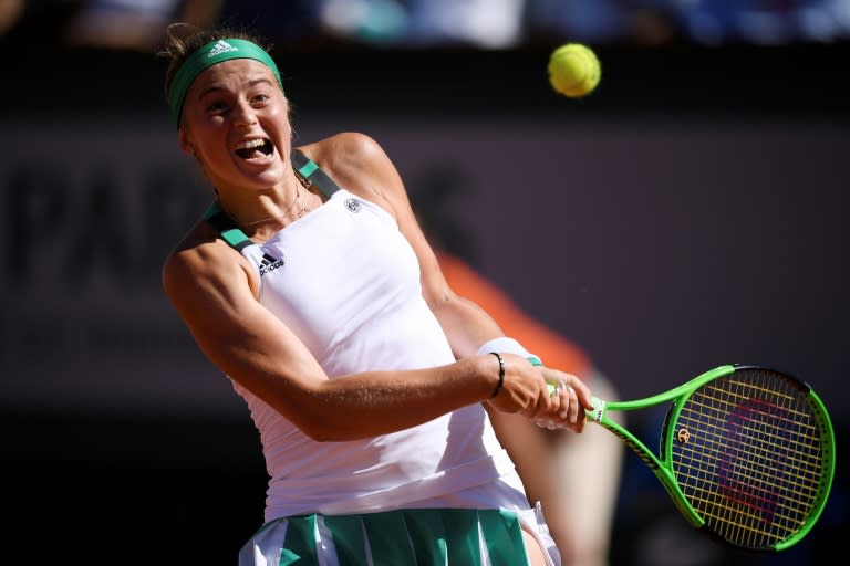 Latvia's Jelena Ostapenko returns the ball to Romania's Simona Halep during their final match at the Roland Garros 2017 French Open on June 10, 2017 in Paris