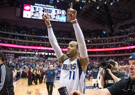 Apr 12, 2014; Dallas, TX, USA; Dallas Mavericks guard Monta Ellis (11) and his team celebrate the win over the Phoenix Suns at the American Airlines Center. The Mavericks defeated the Suns 101-98 and clinched a spot in the NBA playoffs. Mandatory Credit: Jerome Miron-USA TODAY Sports