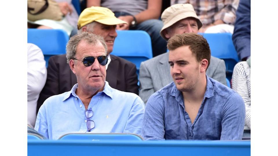 Jeremy Clarkson and son Finlo in blue shirts watching tennis