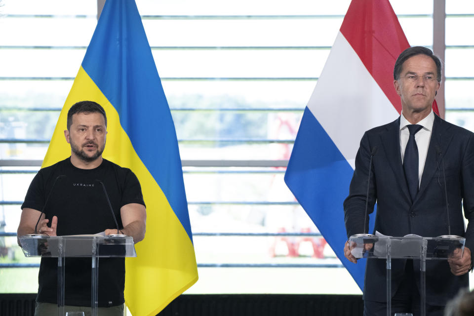 Ukrainian President Volodymyr Zelenskyy and Dutch caretaker Prime Minister Mark Rutte, right, are seen during a press conference in Eindhoven, Netherlands, Sunday, Aug. 20, 2023. The leaders met at a military air base in the southern Dutch city, a day after Zelenskyy visited Sweden on his first foreign trip since attending a NATO summit in Lithuania last month. On Friday, the Netherlands and Denmark said that the United States had given its approval for the countries to deliver F-16s to Ukraine. (AP Photo/Peter Dejong)