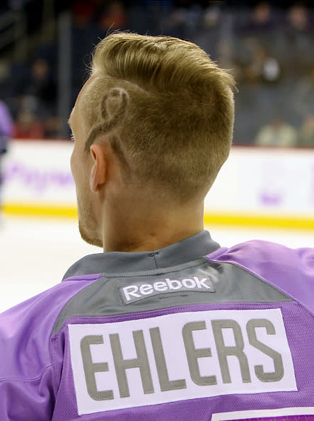 WINNIPEG, MB - NOVEMBER 15: Nikolaj Ehlers #27 of the Winnipeg Jets shows his support for Hockey Fights Cancer night by sporting a lavender jersey and a special haircut during the pre-game warm up prior to NHL action against the Chicago Blackhawks at the MTS Centre on November 15, 2016 in Winnipeg, Manitoba, Canada. (Photo by Jonathan Kozub/NHLI via Getty Images)