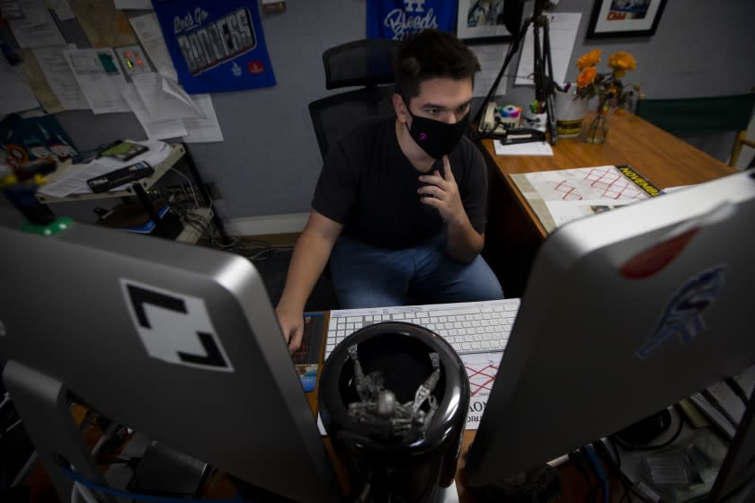 SANTA CLARITA, CA - NOVEMBER 12: Senior Jacob Conard, 17, working on project at Saugus High School on Thursday, Nov. 12, 2020 in Santa Clarita, CA. Jacob Conard is the primary editor on the project. To commemorate the one-year mark after the Saugus High School shooting, a group of students and a teacher - most of whom were in class together the day of the tragedy - have produced a virtual remembrance that will be released for the community on the anniversary. (Francine Orr / Los Angeles Times