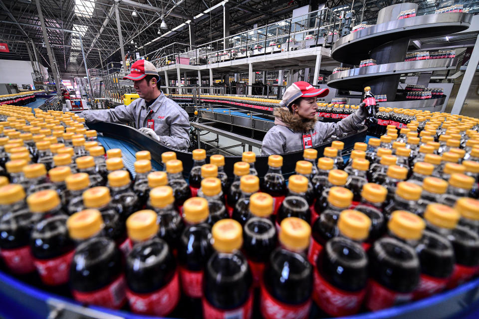 SHENYANG, CHINA - JANUARY 28: Employees work on the production line of Coca-Cola beverages at a factory of COFCO Coca-Cola Beverages Limited on January 28, 2022 in Shenyang, Liaoning Province of China. (Photo by VCG/VCG via Getty Images)