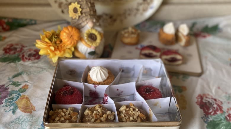 McCormick-Dough tin with doughnuts scattered