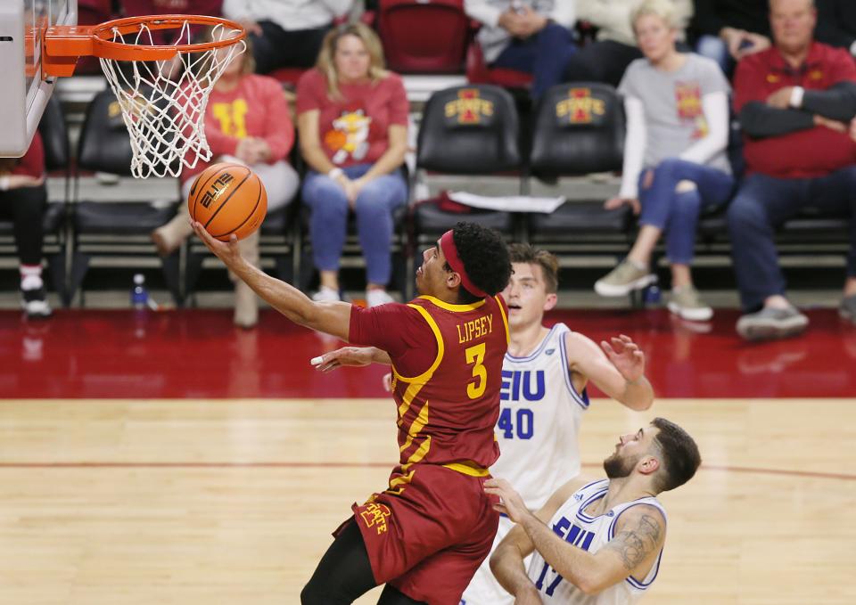 Iowa State Cyclones guard Tamin Lipsey (3) lays up the ball around Eastern Illinois Panthers forward Kooper Jacobi (40) and forward Lazar Grbovic (17) during the second half of a NCAA college basketball at Hilton Coliseum on Thursday, Dec. 21, 2023, in Ames, Iowa.