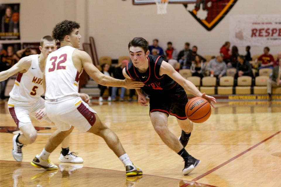 Clinton Prairie's Bailey Good (4) drives against McCutcheon forward Mason Douglas (32) during the third quarter of an IHSAA boys basketball game, Tuesday, Jan. 28, 2020 in Lafayette.