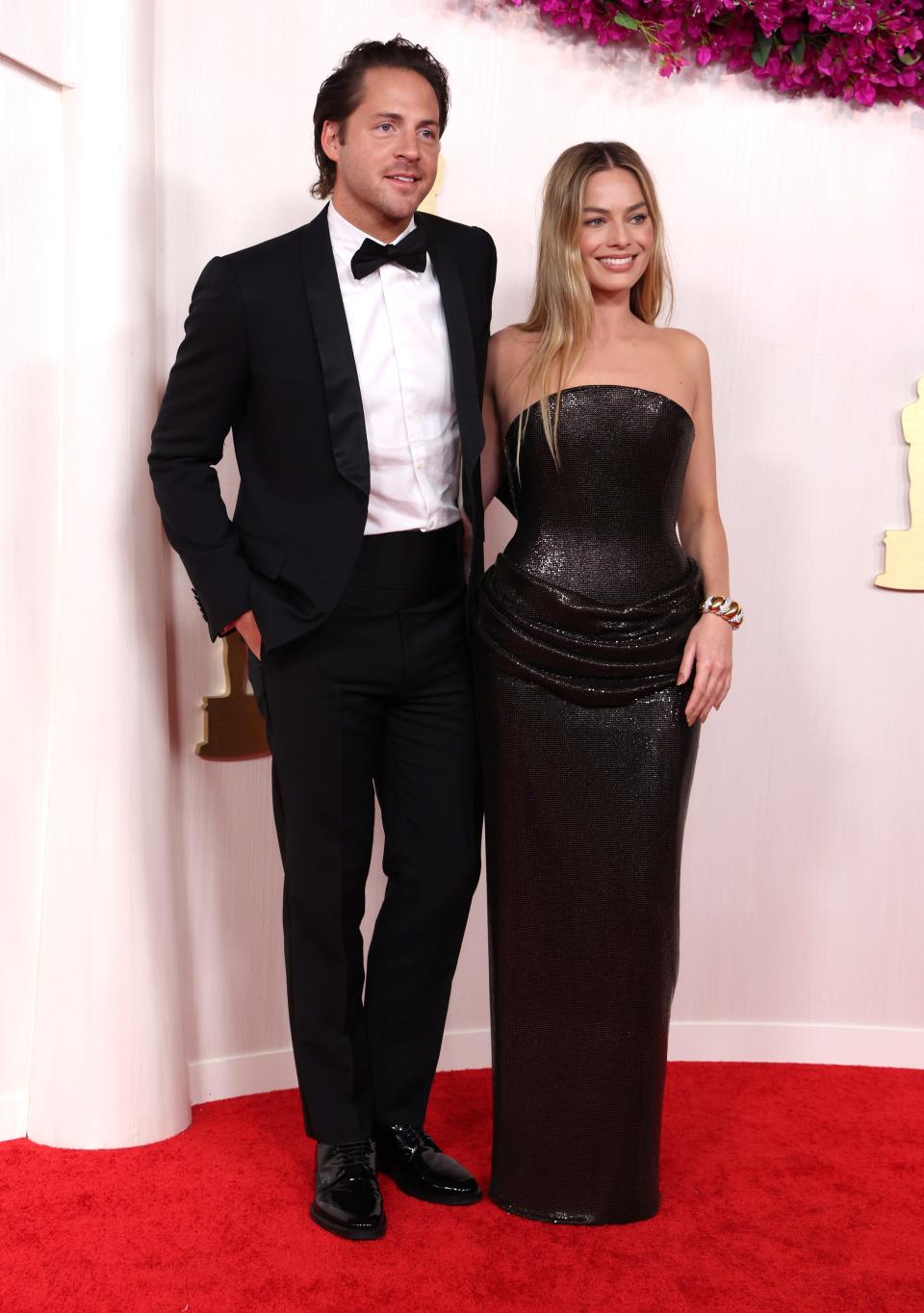 Tom Ackerley and Margot Robbie attend the 96th Annual Academy Awards on March 10.