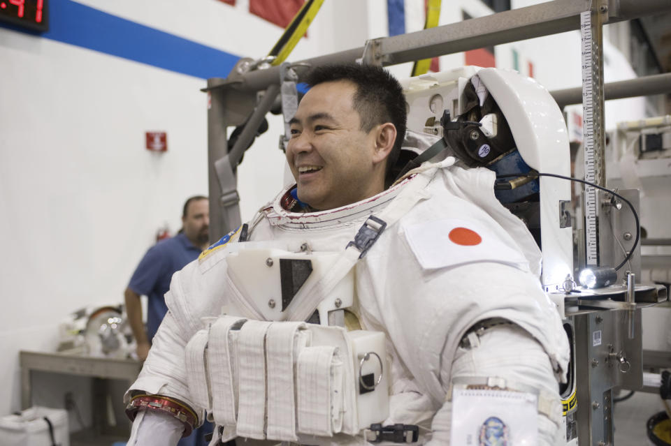 In this Jan. 11, 2012 photo made available by NASA, Akihiko Hoshide of the Japan Aerospace Exploration Agency prepares for spacewalk training at the Neutral Buoyancy Laboratory near the Johnson Space Center in Houston. Hoshide is a member of the crew for SpaceX's third astronaut launch to the International Space Station on Friday, April 23, 2021. (Robert Markowitz/NASA via AP)