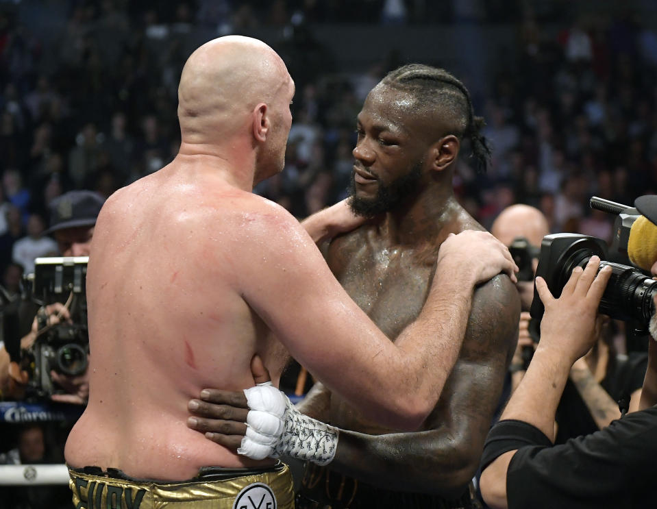 Tyson Fury, left, of England, and Deontay Wilder embrace after their WBC heavyweight championship boxing match, Saturday, Dec. 1, 2018, in Los Angeles. The fight ended in a draw. (AP Photo/Mark J. Terrill)