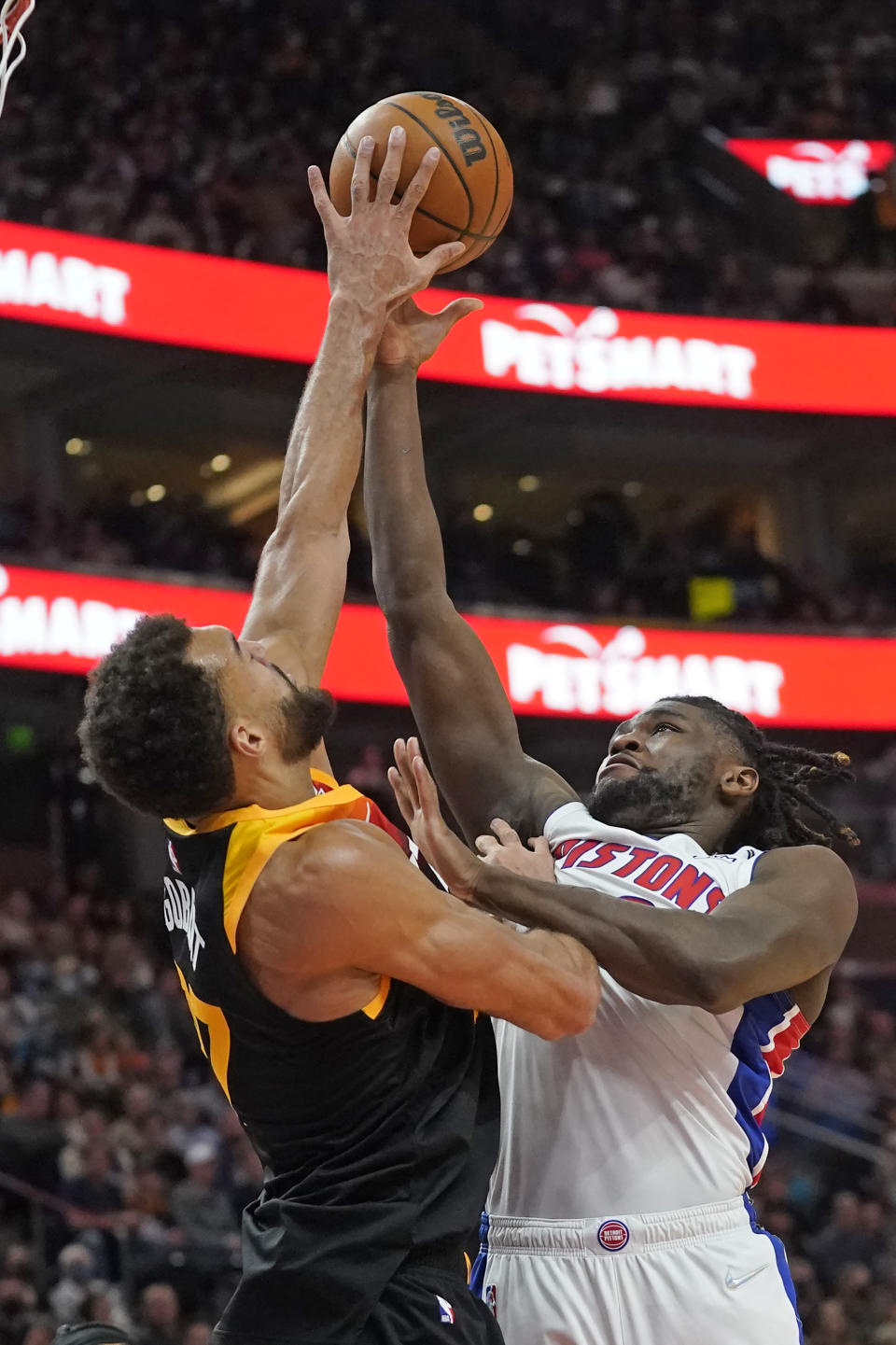 Utah Jazz center Rudy Gobert, left, blocks the shot of Detroit Pistons center Isaiah Stewart, right, in the first half during an NBA basketball game Friday, Jan. 21, 2022, in Salt Lake City. (AP Photo/Rick Bowmer)