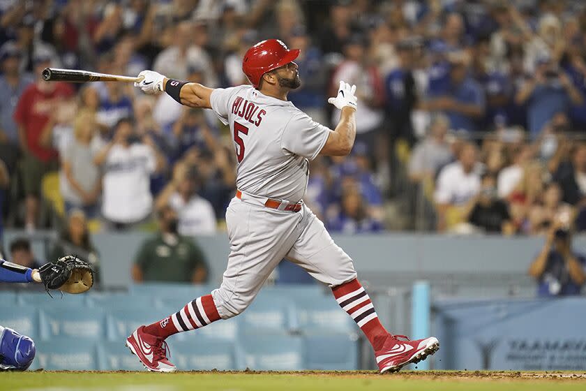 The Cardinals' Albert Pujols watches his home run during the fourth inning against the Dodgers.