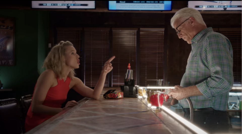 Ted Danson behind the bar serving Kristin Bell's character