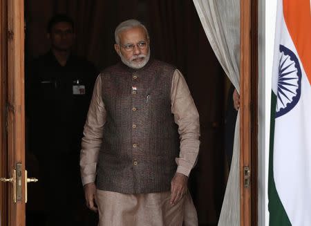 Prime Minister Narendra Modi comes out of a meeting room in New Delhi May 27, 2014. REUTERS/Adnan Abidi