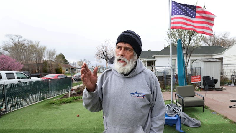 Troy Vialpando talks about his artificial grass at his home in Salt Lake City on Monday, April 1, 2024.  Salt Lake City has asked him to remove the grass since it doesn’t meet code.