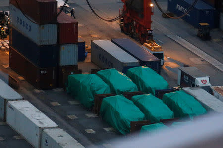 Six of the nine armoured troop carriers belonging to Singapore, from a shipment detained at a container terminal, are seen in Hong Kong, China November 24, 2016. REUTERS/Bobby Yip