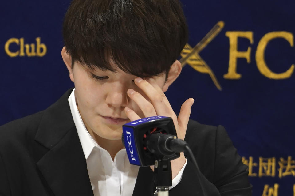 Rina Gonoi, former member of the Japan Ground Self-Defense Forces, listens questions during the press conference at the Foreign Correspondents' Club of Japan, Monday, Dec. 19, 2022, in Tokyo. Gonoi filed a sexual harassment case with the Defense Ministry last year, saying she had suffered multiple assaults by a number of male colleagues, causing her to give up her military career. (AP Photo/Eugene Hoshiko)