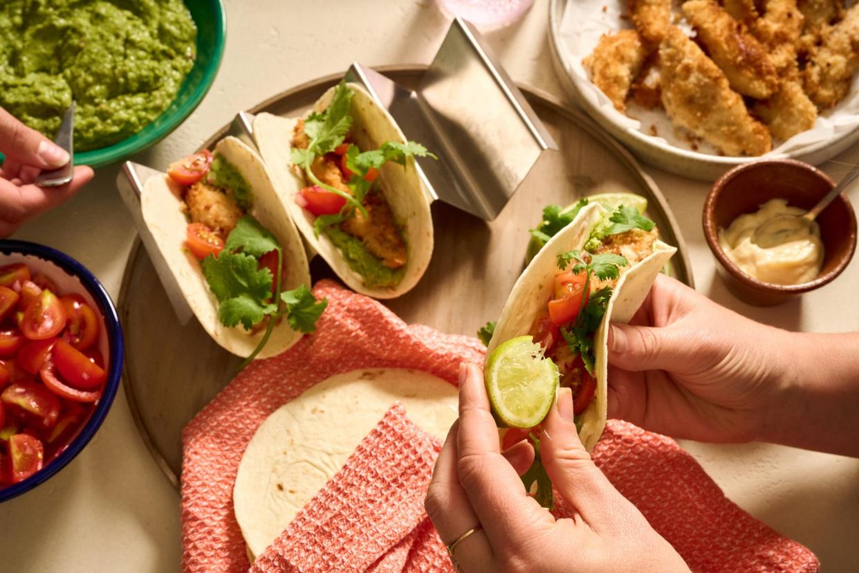 <span>Choose your own taco adventure: Alice Zaslavsky’s fish finger tacos with guacamole, tomato salsa, coriander tendrils and lime. Food prep: Madeleine Dobbin. Styling: Katrina Cleary.</span><span>Photograph: Eugene Hyland/The Guardian</span>