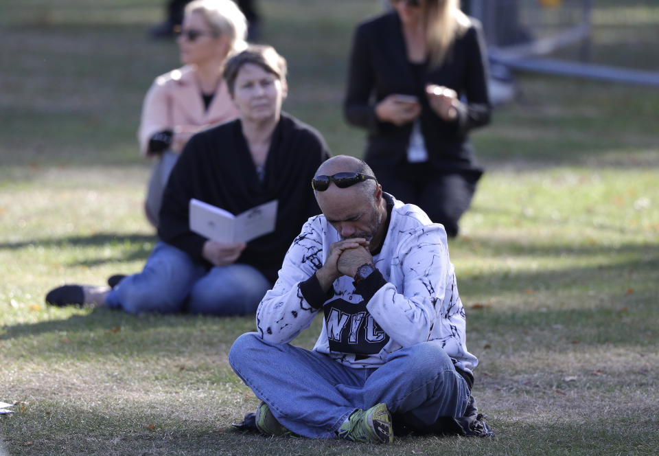 People listen during a national remembrance service in Hagley Park for the victims of the March 15 mosques terrorist attack in Christchurch, New Zealand, Friday, March 29, 2019. (AP Photo/Mark Baker)