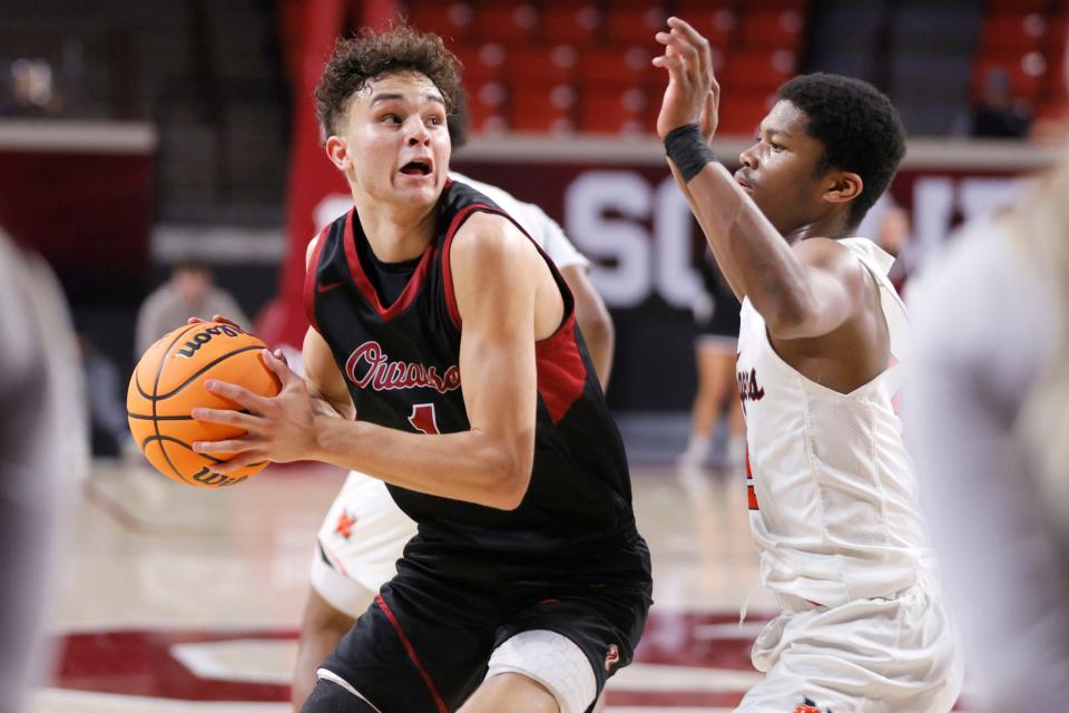 Owasso's Jalen Montonati tries to get past Norman's BJ Randle during a Class 6A boys high school basketball state tournament game between Owasso and Norman at Lloyd Noble Center in Norman, Okla., Wednesday, March 6, 2024.